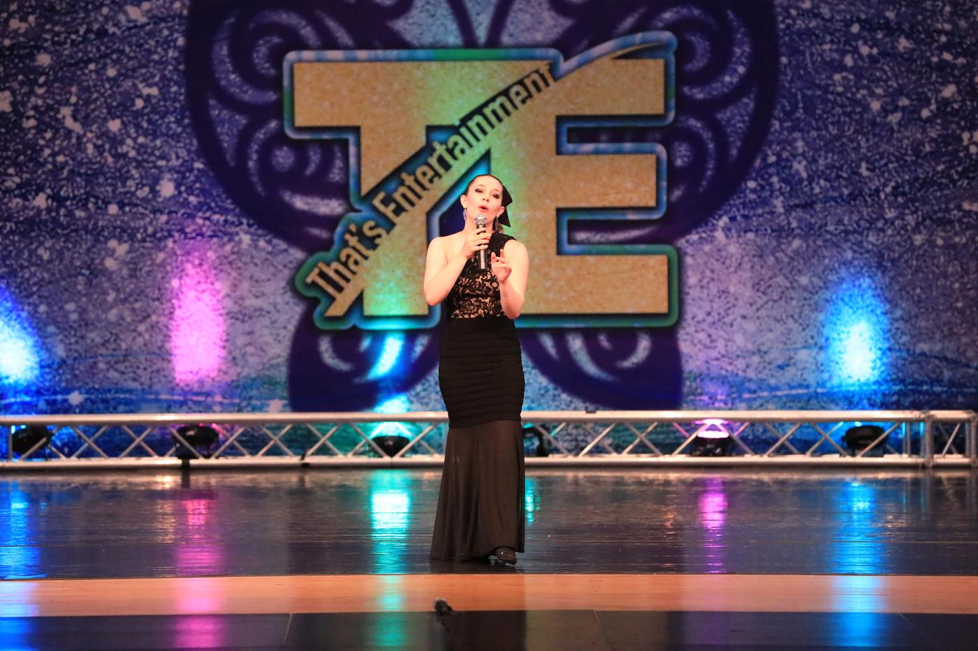Ariella Sinclair singing on national stage in black gown